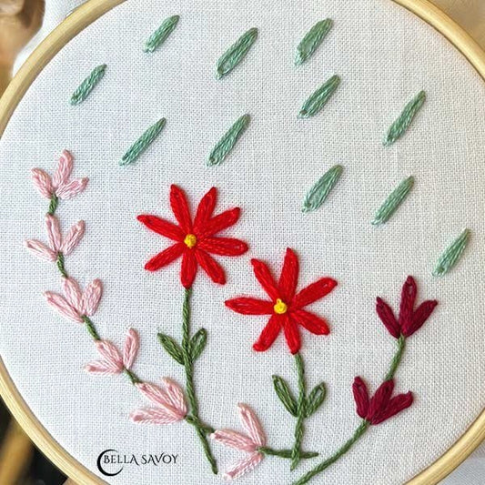 raindrops and flowers made from lazy daisy stitches